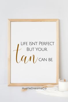 a framed print that says, life isn't perfect but your tan can be