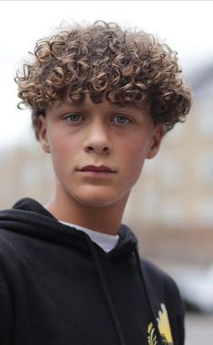 If you have medium-length hair, you can perm it and keep it clean or even casually tousled. Discover more top men`s hairstyles and hair ideas. Coily Hair Men Haircut, Curly Hairstyles For Teen Boys, Teen Curly Hairstyles Boys, Teen Boy Curly Haircut, Curly Hair Boy, Curly Men, Perm Hairstyles, Curly Hairstyles For Men