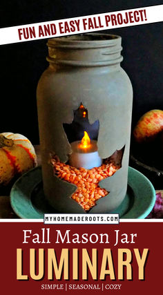 a mason jar filled with corn on top of a plate next to some pumpkins