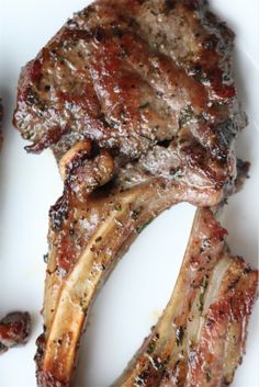 a piece of meat sitting on top of a white plate