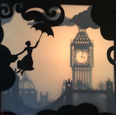 the shadow of a woman holding an umbrella in front of a clock tower