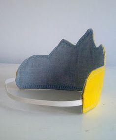 a blue and yellow hat sitting on top of a white plate