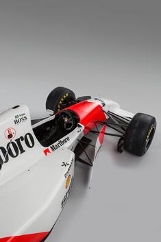 a white and red race car on a gray background