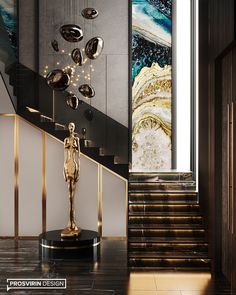 an elegant staircase with a gold statue on it