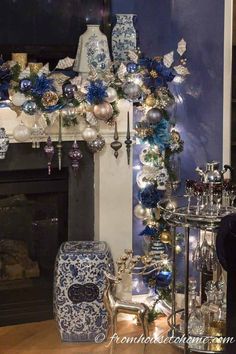 a fireplace decorated with blue and white ornaments