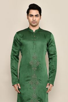 Forest green kurta featuring hand embroidery in the front. Paired with a white pyjama. - Aza Fashions Green Chanderi Sherwani For Navratri, Green Bandhgala With Zari Work For Navratri, Green Cotton Silk Kurta With Embroidered Border, Green Chanderi Sherwani For Eid, Green Chanderi Bandhgala With Zari Work, Green Chanderi Bandhgala With Cutdana, Green Chanderi Bandhgala For Festivals, Green Sherwani With Resham Embroidery, Green Bandhgala With Resham Embroidery For Festivals