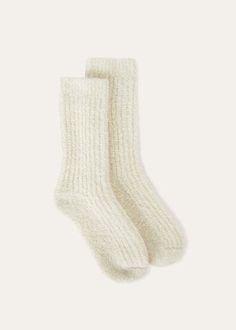 The Cocooning socks envelop you in that rarest of luxuries - the ease of being truly at peace. Spun from the finest undyed cashmere in a breathable half-rib knit, these short socks wrap feet in sublime natural softness and warmth. Ideal for lounging or complementing winter ensembles. Cozy Winter Socks With Soft Texture, Cozy Warm White Socks, Cream Fitted Cozy Socks, Cashmere Bed Socks, Merino Wool Cashmere Socks, King Baby, White Snow, At Peace, Loafer Sneakers