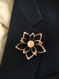 "Men's lapel pin. The pin is made out of satin and organza ribbons in the Japanese kanzashi technic. The flower measures approx. 2.5\" across. The center of the flower is adorned with a ribbon covered button. This listing is for one lapel pin in BLACK/GOLD color combination. This beautiful lapel pin can be made in almost any color or color combination. If you want to request a color please contact me before ordering for availability. The lapel pin is handmade with top quality materials and made Luxury Wedding Lapel Pin For Men, Elegant Formal Brooches With Handmade Flowers, Formal Rose Gold Flower Brooches, Formal Rose Gold Flower Brooch, Elegant Rose Gold Lapel Pin Brooch, Formal Rose Gold Flower Shaped Brooch, Elegant Handmade Flower Pins As Gift, Elegant Handmade Flower Pins For Gifts, Formal Handmade Flower Brooches