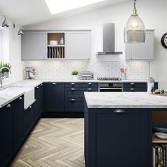 a kitchen with blue cabinets and white counter tops