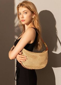 Indulge in luxury with our Woven Raffia Saddle Bag, expertly crafted with a blend of raffia and leather. Its adjustable shoulder strap ensures a perfect fit for women of all sizes. Elevate your style with this exclusive and elegant addition to your wardrobe. Size info 10 5/8" (27cm) width 6 3/4"(17cm) height 3"(8cm) depth Details Raffia and genuine cowhide leather Polyester lining Adjustable shoulder strap Interior wall pocket and zipper pocket Top zip closure Item #462501 Women's saddle shoulde Natural Color Crochet Bag With Woven Leather, Natural Colored Crochet Bag With Woven Leather, Luxury Straw Shoulder Bag In Rectangular Shape, Luxury Rectangular Straw Shoulder Bag, Chic Woven Leather Straw Bag With Top Handle, Elegant Woven Leather Summer Bag, Elegant Woven Leather Shoulder Bag For Vacation, Luxury Straw Tote Shoulder Bag, Elegant Brown Crochet Bag With Woven Leather