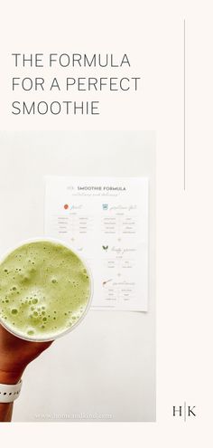 the formula for a perfect smoothie is displayed in front of a hand holding a paper