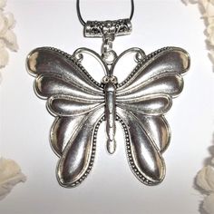 Silver Butterfly Necklace, Statement Necklace, Pendant, Butterfly, Necklace A143 This Extra Large Butterfly Necklace Is Sure To Get You Lots Of Compliments. Brand New Nwt And Handmade By Me - Wvluckygirl. Hand Crafted With An Antiqued Silver Toned Costume Jewelry Butterfly Charm. If You Look At The Bail On Top There Is A Lovely Floral Design. The Pendant And Bail Measure 2 3/4 Inches Tall And 2 3/4 Inch Wide. Very Big And Heavy. A Great Statement Piece. Comes With A 36 Inch Black Nylon Rope Cord Elegant Silver Metal Butterfly Necklace, Silver Metal Butterfly Necklace, Silver Butterfly Necklace For Party, Silver Pewter Jewelry Gift, Nickel-free Pewter Necklaces As Gift, Silver Metal Necklace With Butterfly Charm, Nickel-free Pewter Necklace For Gift, Silver Necklace With Butterfly Charm, Vintage Silver Necklace With Butterfly Charm