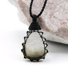 Beautiful handmade macrame-wrapped Tourmalated Quartz pendant, with an adjustable black necklace cord. Tourmalated Quartz is known as a powerful crystal that combines and amplifies the properties of Tourmaline and Clear Quartz Crystal. It is believed to offer physical protection acts as a negativity shield, and brings to the wearer's life luck, grounding, and balancing energy. This necklace can be a perfect meaningful gift for your loved one or yourself! ►►This is a one-of-a-kind necklace, you w Hand Wrapped Black Jewelry With Waxed Cord, Black Crystal Necklace With Adjustable Cord, Black Pendant Jewelry With Waxed Cord, Black Jewelry With Adjustable Cord For Healing, Black Waxed Cord Pendant Jewelry, Spiritual Black Crystal Necklace With Adjustable Cord, Black Pendant Necklace With Waxed Cord, Black Pendant Necklace On Waxed Cord, Macrame Crystal Necklace