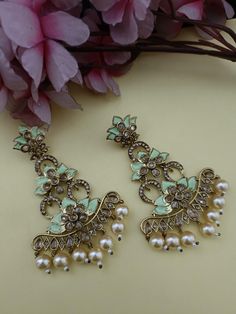 Heavy kundan jhumka earrings/ latest Meenakari Long Earrings kundan earring/jadau kundan earring/best kundan jewelry / Indian wedding jhumka We bring you casual as well as party wear jewelry which comes with an attractive design and helps in boosting your style factor. A classic fusion of exquisite craftsmanship and elegance, this jewelry tries to make you look graceful and stylish when paired with your attire. It goes well with modern and traditional outfits.  These Earrings are made of Alloy, Pure Copper and Kundan and Pearls . Trust me the quality of Earrings is the Best  Women love jewelry; specially traditional jewelry adore a women. They wear it on different occasion. They have special importance on ring ceremony, wedding and festive time. They can also wear it on regular basics. Mak Diwali Kundan Meenakari Bridal Earrings, Festive Bridal Kundan Earrings With Meenakari, Festive Kundan Chandelier Earrings With Meenakari, Green Zari Work Earrings For Wedding, Kundan Meenakari Bridal Earrings Gift, Green Kundan Chandelier Earrings With Meenakari, Party Meenakari Kundan Bridal Earrings, Kundan Meenakari Bridal Earrings For Party, Meenakari Kundan Bridal Earrings For Party