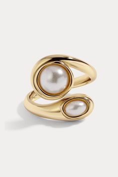 Product Details Available in 14kt gold plated brass or Rhodium plated brass Stones are glass pearl, and measure approx. 6.0mm - 8.0mm each Runs true to size Size & Fit Model is wearing a size 7 Model is 5'11" with a 34" bust, and 23" waist Product Care: METAL: Use a soft cloth to gently wipe clean, then remove any remaining impurities with mild diluted soap. Rinse with warm water and dry thoroughly before storing in the provided jewelry pouch. Do not use abrasive cleaners, steamers or ultrasonic Luxury Modern Rings With Smooth Finish, Luxury Polished Finish Rings For Women, Luxury Polished Finish Jewelry For Her, Luxury Classic Design Ring Jewelry, Modern Luxury Jewelry With Polished Finish, Luxury Chic Rings With Polished Finish, Luxury Designer Rings With Polished Finish, Luxury Rounded Jewelry With Shiny Finish, Luxury Contemporary Rings With Polished Finish