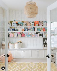 a room with bookshelves and toys in it