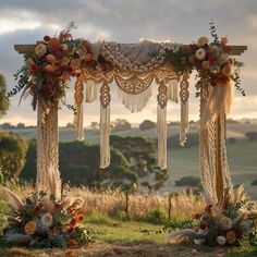 an outdoor wedding setup with flowers and fringes on the arbor, surrounded by grass