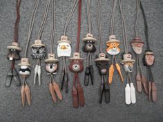 a group of different types of hats and spoons on a gray carpeted floor