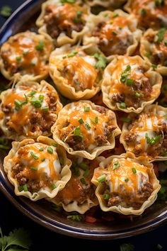 a platter filled with meat and cheese cups