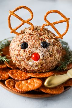 a plate with crackers and pretzels in the shape of a reindeer's head