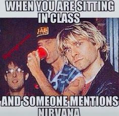 two people standing next to each other in front of a sign that says when you are sitting in class and someone mentions nirvana