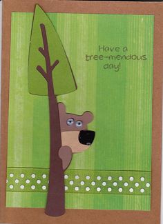 a handmade card with a bear and tree in the background that says, have a tree - mendous day