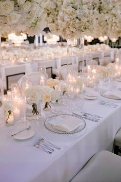 Tall white floral centerpiece with candles for a luxury wedding table. Luxury Wedding Centerpieces, White Wedding Reception, White Table Settings, White Weddings Reception, Luxury Weddings Reception, Summer Wedding Decorations, Sonoma Wedding, Napa Wedding