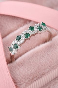 Emerald gemstone is never out of fashion. Shop this pear cut emerald ring. #emeraldring #engagementring #rings #stylishring #vintagering White Gold Emerald Ring With Round Cut For Wedding, White Gold Cluster Ring With Half Eternity, Anniversary White Gold Cluster Ring With Half Eternity, Green Diamond Half Eternity Ring For Anniversary, Green Diamond Ring For Anniversary With Half Eternity Band, Green Cluster Ring For Weddings, Green Half Eternity Ring For Anniversary, Classic Stackable Emerald Ring For Wedding, Wedding Emerald Ring With Diamond White Prong Setting