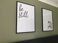 two black and white posters hanging on the wall