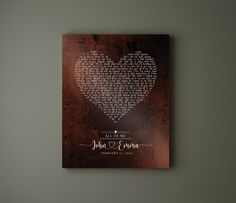 a wedding guest book with a heart on it