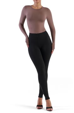 Sculpt your silhouette with this stretchy bodysuit cut from soft-to-the-touch fabric for a second-skin feel. Crewneck Long sleeves 88% polyester, 12% spandex
 Machine wash, line dry
 Imported Model stats: 5'10", 32" bust, 25" waist, 36" hip. Model is wearing size Small. High Stretch Solid Bodysuit For Dancewear, High Stretch Full Length Elastane Unitard, High Stretch Shapewear Unitard, Fitted Full Length Bodysuit For Winter, Fitted Full-length Winter Bodysuit, Stretch Shapewear Unitard, High Stretch Full Length Dancewear Bodysuit, Solid Color Second-skin Bodysuit For Dancewear, Micro-elastic Shapewear Leotard