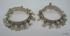 "Vintage Antique ethnic collectible very nice tribal old silver charm Bracelet or bangle pair from Rajasthan India. Worn by Banjara tribal people of Rajasthan. Beautiful workmanship all over the piece, adorn with silver charms. One quarter-hinged part can be open by pin. Original old pair in good condition with great antique look. great pair for jeweley collection. Inner diameter across - 5.3 cm(2\") Inner circumference -16.6 cm (6.5\") width include charms - 2.6 cm(1\") weight for pair - 92.5 g Festival Silver Beads Bangle Jewelry, Traditional Metal Bangle For Festival, Traditional Antique Silver Bracelet For Festive Occasions, Traditional Metal Bracelets For Festivals, Ornate Handmade Metal Bangle, Bohemian Antique Silver Metal Bangle, Handmade Ornate Metal Bangle, Traditional Silver Bracelets, Bohemian Silver Metal Bangle