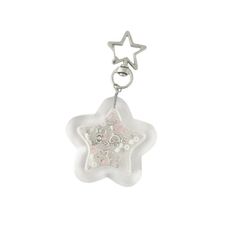 a key chain with a star charm hanging from it's side on a white background