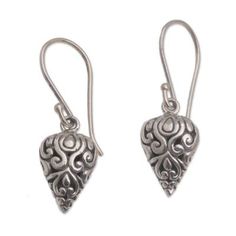 Wayan Asmana proudly presents a regal pair of dangle earrings from Bali in celebration of local craftsmanship. Crafted of sterling silver by local artisans each earring takes a pointed shape elaborated with swirling vine patterns. Ornate Sterling Silver Teardrop Earrings For Gift, Ornate Sterling Silver Teardrop Earrings As Gift, Traditional Nickel-free Sterling Silver Teardrop Earrings, Traditional Nickel-free Teardrop Earrings As A Gift, Traditional Nickel-free Teardrop Earrings For Gift, Artisan Sterling Silver Teardrop Dangle Earrings, Traditional Sterling Silver Teardrop Earrings As Gift, Artisan Long Drop Sterling Silver Earrings, Traditional Handmade Sterling Silver Teardrop Earrings