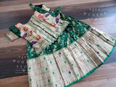 This Lehenga set suits 6 yr - 7 yr. Kindly Please Message me If needed measurements before purchase.   SHOP OUR COLLECTIONS ALSO FROM WWW.VAVSWOMENSSTOP.COM  ALL SALES ARE FINAL. All products showcased by VAVS WOMENS STOP are completely customized with love and lots of care. Keeping in mind with hygiene reasons and customers safety we are strictly not accepting returns/exchanges. Please feel free to ask any questions related to the product such as measurements or color before purchasing itself. We are always glad to help our beloved customer for easy checkout. Disclaimer : 1)All pictures are taken in natural light but still there might be little color variation because of photography, gadget settings of every phone. 2)Zari Folds, Tiny Knots, Loose threads, Gaps in weaving, small holes on t Festive Green Matching Set, Fitted Multicolor Sets For Celebration, Fitted Green Set For Celebration, Multicolor Matching Sets For Wedding, Fitted Green Celebration Set, Fitted Green Celebration Sets, Festive Multicolor Matching Set, Designer Lehenga Blouse, Lehenga Blouse Designs