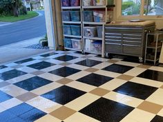 a black and white checkered floor in a room with lots of bookshelves