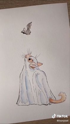 a drawing of a cat and a bat flying in the sky