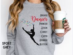 It's time we all recognize and celebrate the best reindeer of them all - DANCER! Great gift for the dancers, dance teachers, and lovers of holiday puns in your life!  Looking for other styles or a matching accessory? Look no further! 🛍️ Canvas Bag: https://sarahsapparelstudio.etsy.com/listing/1577095029 👚 T-Shirt: https://sarahsapparelstudio.etsy.com/listing/1576882043 🎽 Tank Top: https://sarahsapparelstudio.etsy.com/listing/1577070595 👧 Youth Tee: https://sarahsapparelstudio.etsy.com/listin Dress Like A Reindeer For School, Circut Joy, Dancer Things, Reindeer Cute, Holiday Puns, Teacher Gift Christmas, Dancer Shirt, Dance Comp, Santa's Reindeer