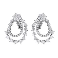 These elegant 18kt white gold earrings showcase 4.95cts of dazzling pear and round diamonds in an elaborate loop pattern. Handcrafted in Italy by ZYDO Italian Jewelry.
Diamond Quality: Color F, Clarity VSDiamond Carat Weight: 4.95Dimension: 1 1/14 in. x 1 in. Italian Jewelry, Loop Earrings, White Gold Earrings, Jewelry Diamond, Classic Chic, Pear Shaped Diamond, Pendant Rings, Ring Collections, Boutique Jewelry