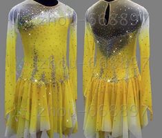 the figure skating dress is yellow and has sequins on it, as well as silver