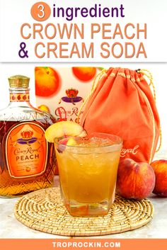 an orange drink sitting on top of a table next to some fruit and bottles with the words 3 ingredient crown peach and cream soda