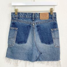 "Vintage 720 Medium Wash Altered Reworked Levis Denim Skirt//Nice slim fit! 28\" waist, 14.5\" front length, 15.75\" back length, 34\" hips. Would fit a size XS/24/ best, but please compare your measurements and ask me questions! Amazing condition with awesome wear and fading and custom pocket placement that adds great character! Price firm We ship internationally!  SVS00437" Fitted Cutoff Dark Wash Denim Skirt, Fitted Cutoff Denim Skirt With Pockets, Fitted Cutoff Mini Skirt With Pockets, Medium Wash Patchwork High-waist Denim Skirt, Medium Wash High Waist Patchwork Denim Skirt, High Waist Patchwork Denim Skirt In Medium Wash, Reworked Cutoff Denim Bottoms, Denim Patchwork Mini Skirt, Casual Reworked Blue Denim Skirt