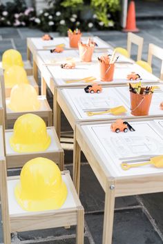 the tables are set up with construction themed place settings