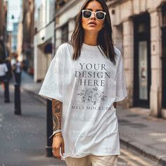 Elevate your brand's visual appeal with this street-style inspired white t-shirt mockup. Perfect for showcasing your designs on the iconic Comfort Colors 1717 tee. This high-resolution digital download is easy to use; just overlay your design and you're ready to impress your customers. Whether you're launching a casual fashion line or showcasing a graphic tee, this mockup provides a realistic setting that highlights the urban chic aesthetic. This mockup is also a part of bundles at a discounted White Custom Print Shirt For Streetwear, Oversized White Tops With Custom Print, Oversized White Top With Custom Print, White Oversized Shirt With Custom Print, White Custom Print T-shirt For Streetwear, Oversized White T-shirt With Branding, Urban White T-shirt With Branding, Urban Style White T-shirt With Branding, White Comforter