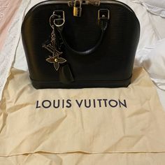 Beautiful Bag In Excellent Condition. Comes With Dust Bag. Classic Black Bags, Classic Black Bags As Fashion Accessory, Classic Black Bag As Fashion Accessory, Black Bags With Palladium Hardware, Luxury Black Shoulder Bag With Engraved Logo, All Black Louis Vuitton Bag, Louis Vuitton Fur Bag, Black Louis Vuitton Bag 1stdibs, Louis Vuitton Alma Pm