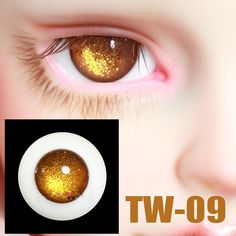 an eye with gold glitter on it and the words tw - 09 above it