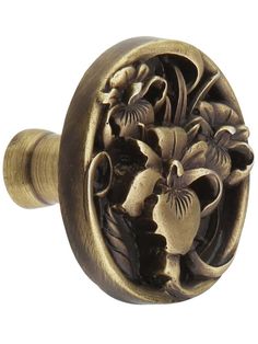 an antique style door knob with flowers on it