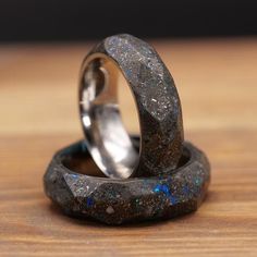 This Patrick Adair Designs Tungsten-Carbide Glow Ring includes authentic gibeon meteorite shavings, crushed diamonds, crushed moonstone, and crushed blue opal, making for a perfect glowing wedding band or engagement ring. I designed this ring with a space/galaxy mindset and set out to make it look like the materials were taken from the moon. This is all done on a Tungsten-Carbide backdrop which is heavy, durable, and scratch-resistant. Check out my YouTube video on how I make it: https://www.you Obsidian Wedding Rings, Mens Obsidian Wedding Ring, Men’s Galaxy Wedding Band, Obsidian Mens Wedding Band, Wedding Rings Meteorite, Glow Ring, Crushed Diamonds, Carbon Fiber Rings, Galaxy Ring