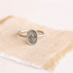 A kiss from the sun.  Full of life and warmth. This sweet stamped silver ring is perfect alone or stacked with other rings.  Sterling silver.  Please select your ring size during checkout. Your jewelry will arrive beautifully gift wrapped in a small box. Multiple items will be combined, unless separate boxes are reques Silver Dainty Stamped Ring, Dainty Stamped Silver Rings, Spiritual Nickel-free Rings For Everyday, Spiritual Silver Stackable Rings For Everyday, Silver Spiritual Stackable Rings For Everyday, Dainty Silver Engraved Oval Ring, Silver Spiritual Rings For Everyday Wear, Sterling Silver Sun Design Ring For Gift, Sterling Silver Sun Design Ring