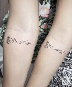 two people with matching tattoos on their arms, one has the word love written in cursive writing